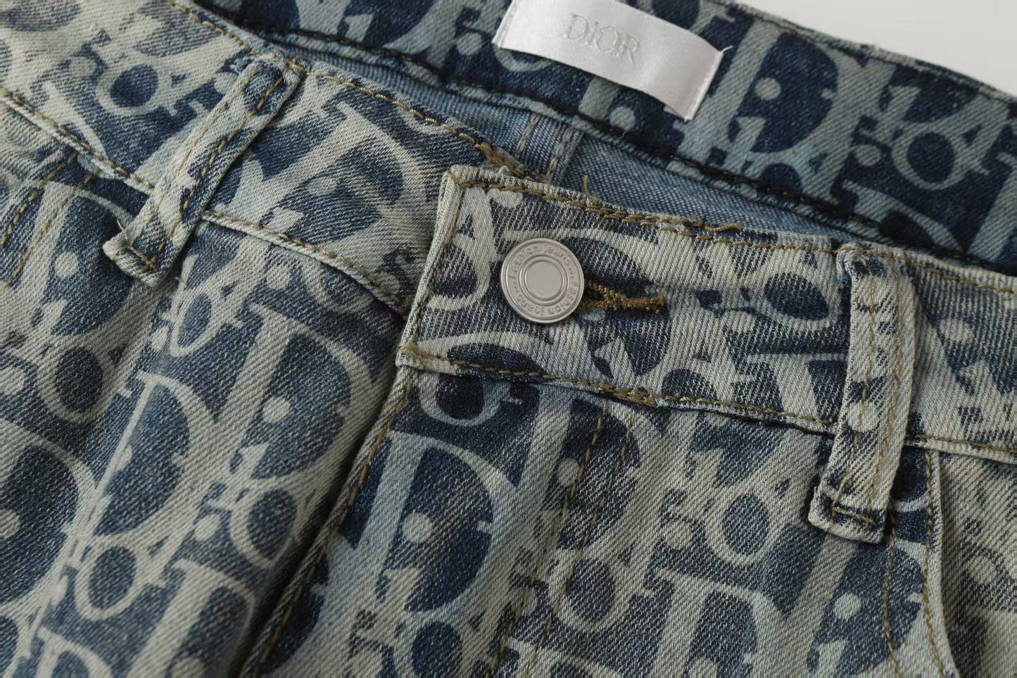 Oblique All-Over Print Faded Denim Jeans | Blue